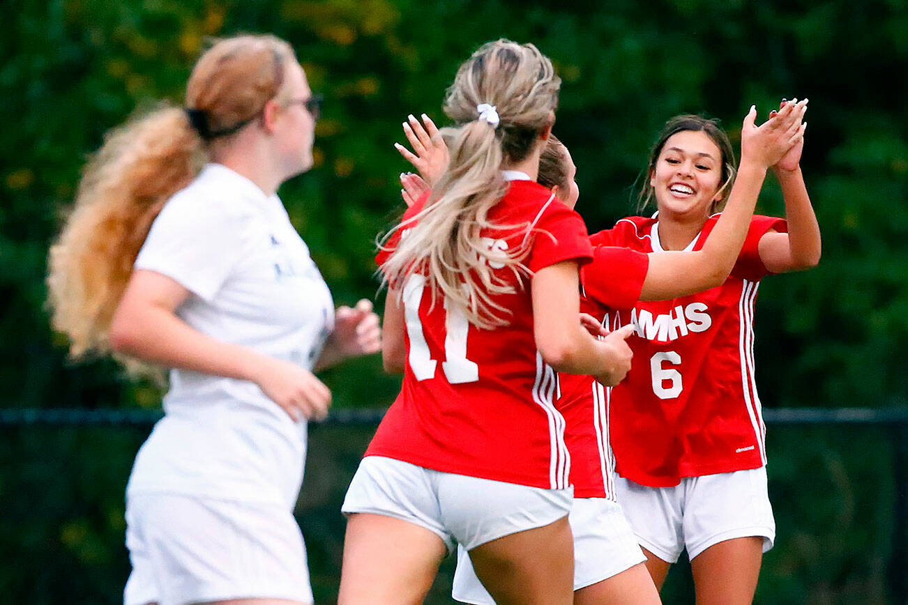 The Wildcats celebrate a goal in the first half of play at Archbishop Murphy High School Tuesday night in Everett on September 14, 2021. The Wildcats won 6-1. (Kevin Clark / The Herald)