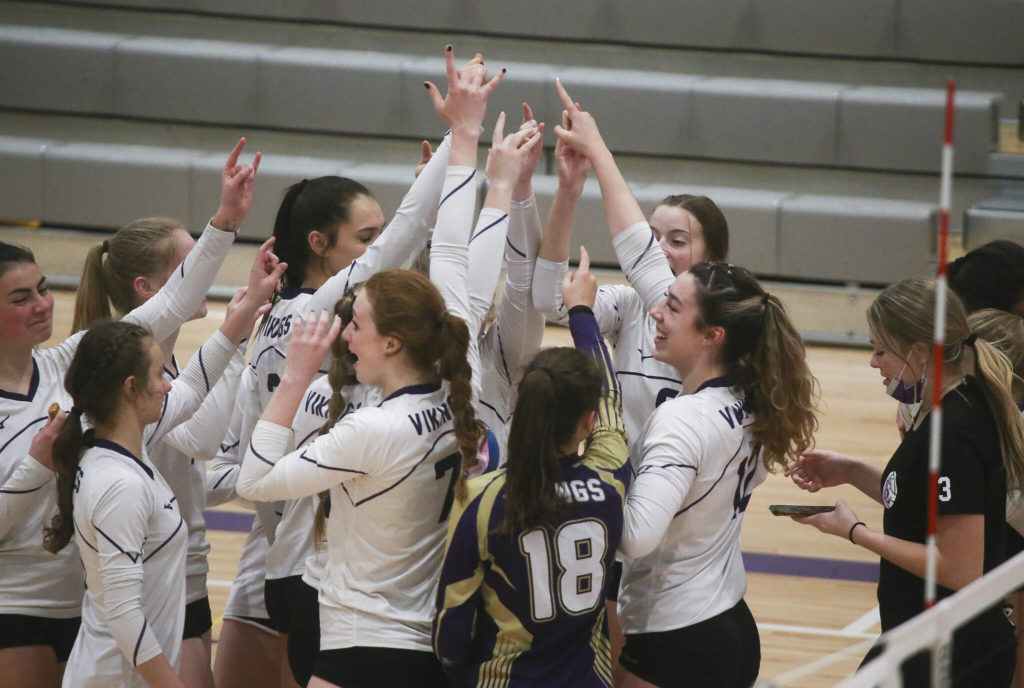 Lake Stevens celebrates after beating Mount Si in five sets in a Class 4A Wes-King Bi-District tournament semifinal volleyball matchup Tuesday in Lake Stevens. (Andy Bronson / The Herald)
