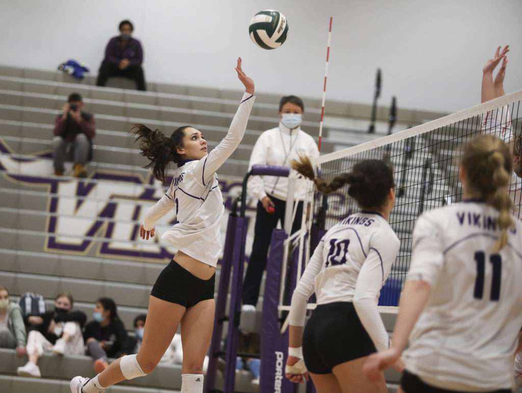 Lake Stevens’ Isabella Christensen taps the ball over the net. (Andy Bronson / The Herald)
