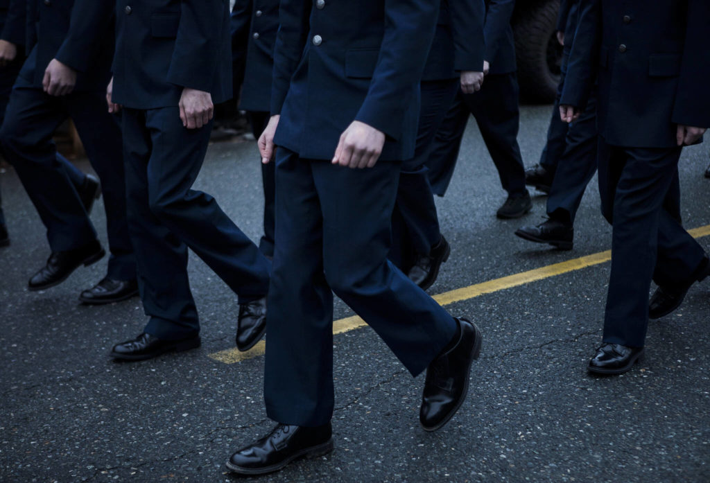 Arlington High School ROTC members walk down Olympic Avenue during the Veterans Day Parade on Thursday, Nov. 11, 2021 in Arlington, Wa. (Olivia Vanni / The Herald)
