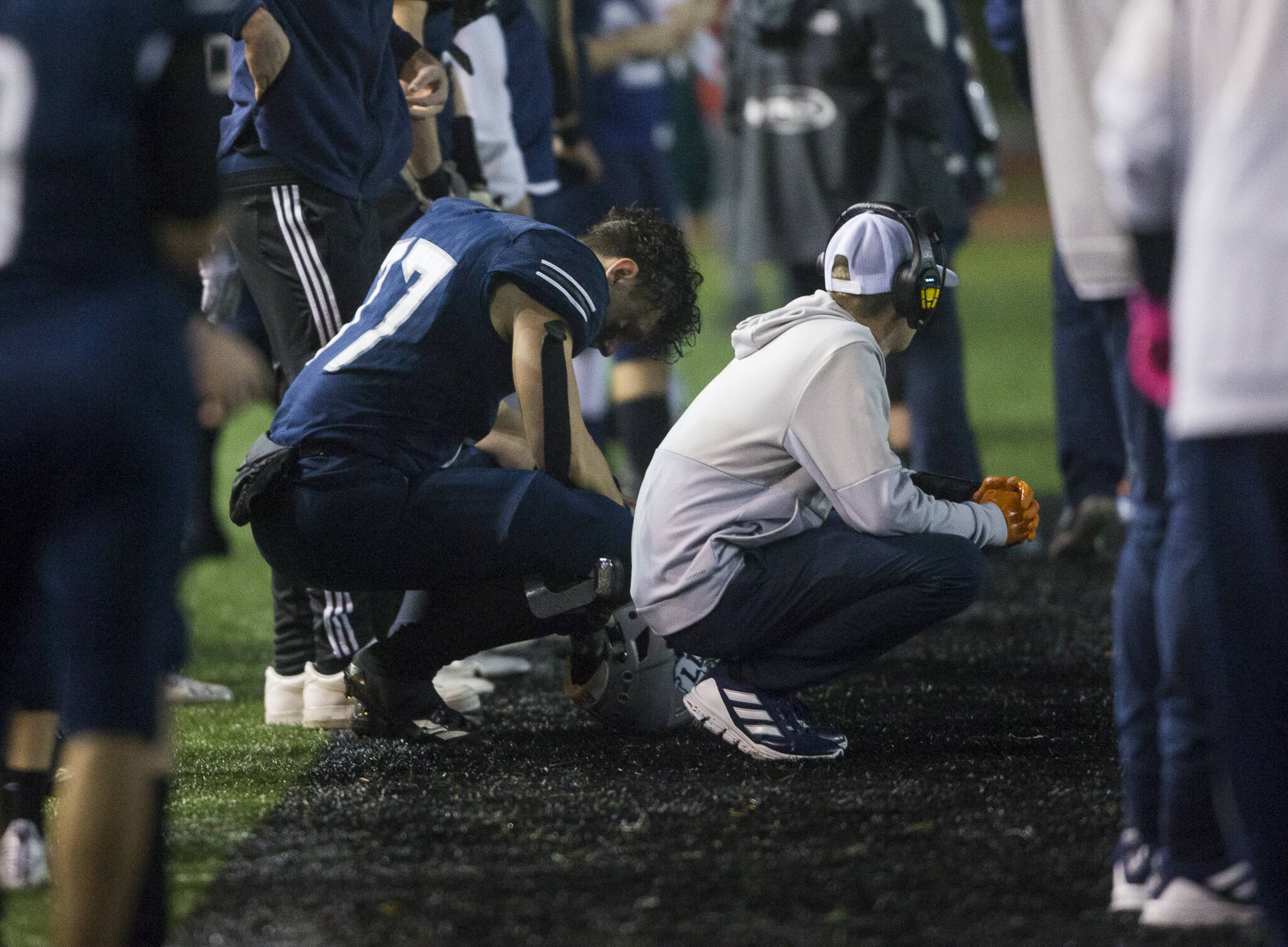 Glacier Peak’s Joe Johnson and a coach react to losing to Bothell and being knocked out of the playoffs on Friday, Nov. 12, 2021 in Snohomish, Wa. (Olivia Vanni / The Herald)
