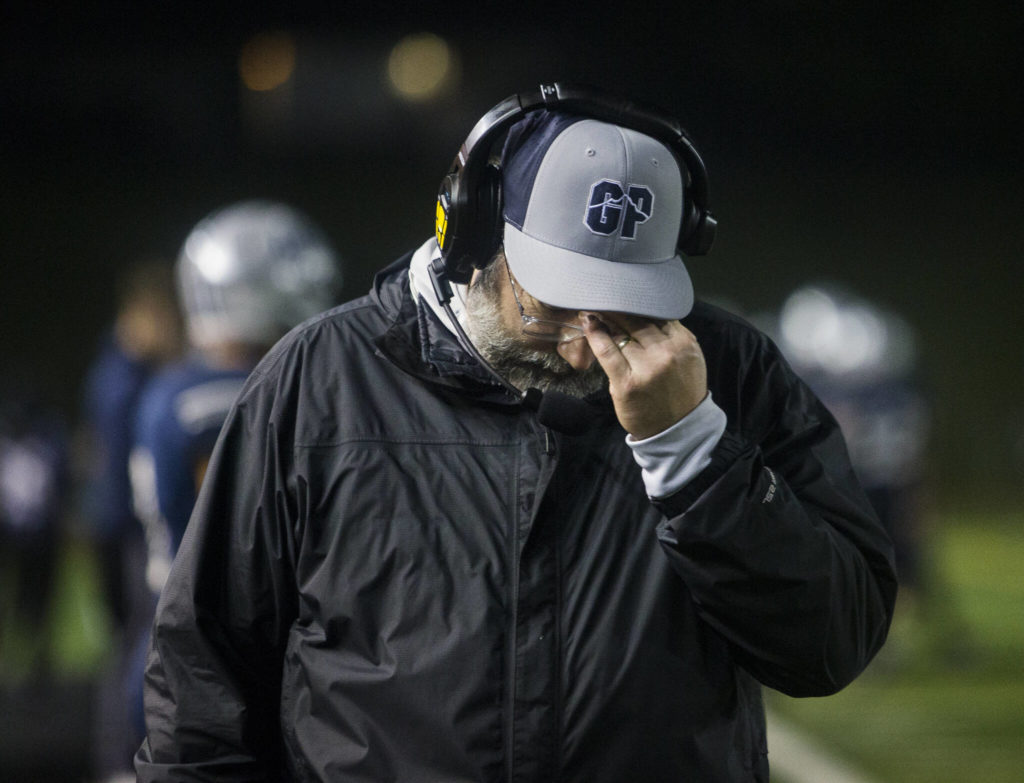 A Glacier Peak coach rubs his head after losing to Bothell on Friday, Nov. 12, 2021 in Snohomish, Wa. (Olivia Vanni / The Herald)

