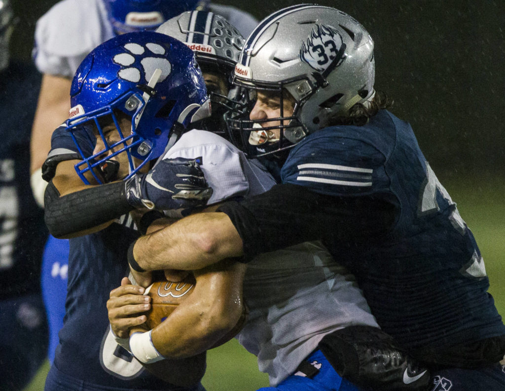 Glacier Peak’s Reggie Valmonte tackles Bothell’s Ahmani Hopoi during the game on Friday, Nov. 12, 2021 in Snohomish, Wa. (Olivia Vanni / The Herald)
