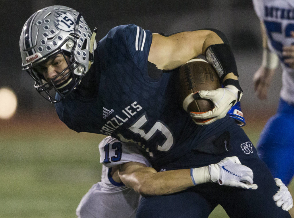 Glacier Peak’s Trey Leckner is tackled by Bothell’s Cody Petrin during the game on Friday, Nov. 12, 2021 in Snohomish, Wa. (Olivia Vanni / The Herald)
