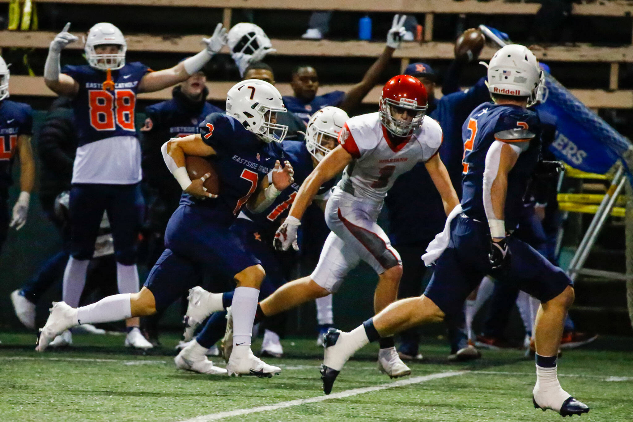 Eastside Catholic’s Drew Sanidad returns a punt for a touchdown in the second quarter Friday night during the 3A playoff game at Memorial Stadium in Seattle on November 12, 2021. Eastside Catholic led 28-6 at the half. (Kevin Clark / The Herald)
