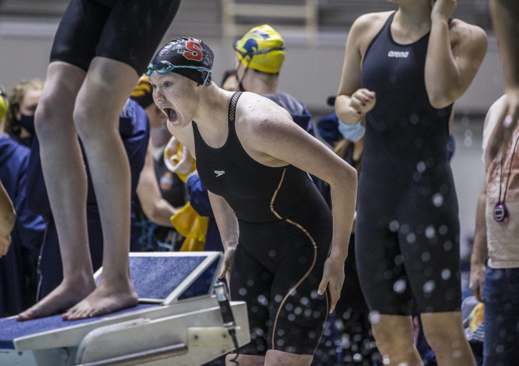 Mary Clarke cheers on her teammates during the 200 Yard Medley Relay at the 3A Girls State Swim & Dive Championship on Saturday, Nov. 13, 2021 in Federal Way, Wa. (Olivia Vanni / The Herald)
