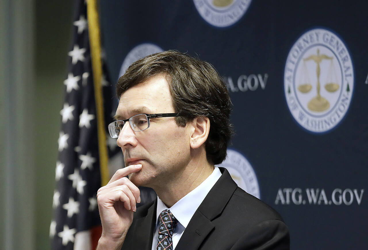 Washington state Attorney General Bob Ferguson looks on during a news conference in Seattle on Dec. 17, 2019. (AP Photo/Elaine Thompson, File)