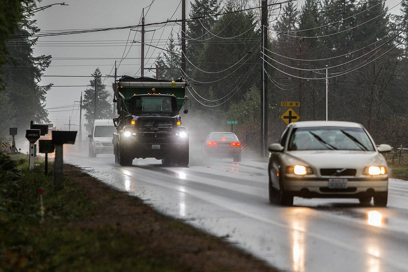 A car breaks and waits for traffic to pass before turning onto 123rd Avenue on Monday, Nov. 22, 2021 in Lake Stevens, Wa. (Olivia Vanni / The Herald)