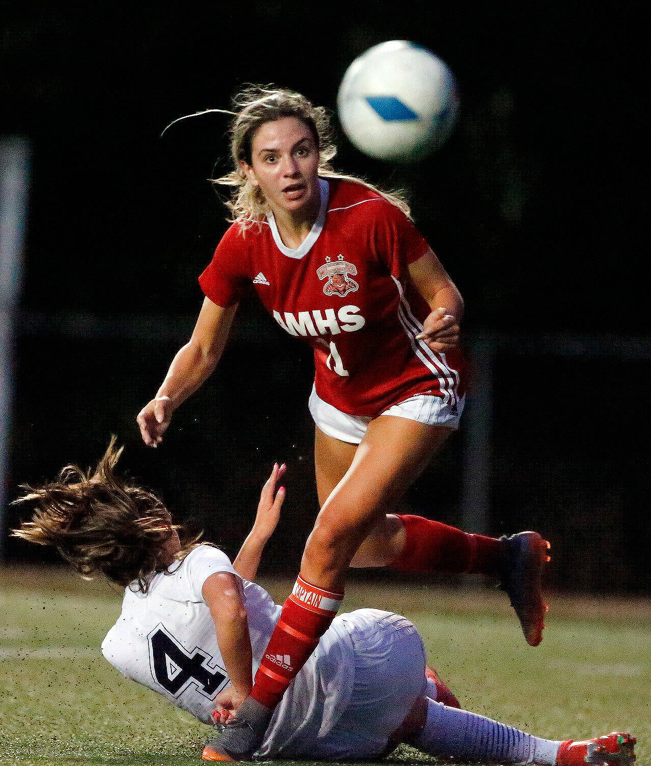 Archbishop Murphy’s Taylor Campbell (top) and Arlington’s Maddy Stivers battle for the loose ball during a game Sept. 14 at Archbishop Murphy High School in Everett. (Kevin Clark / The Herald)