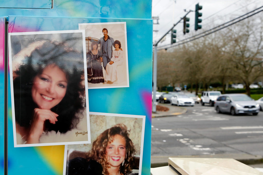 Shannon Sessions’ mom, Linda Shipp, adorns a signal box at Alderwood mall. (Kevin Clark / The Herald)
