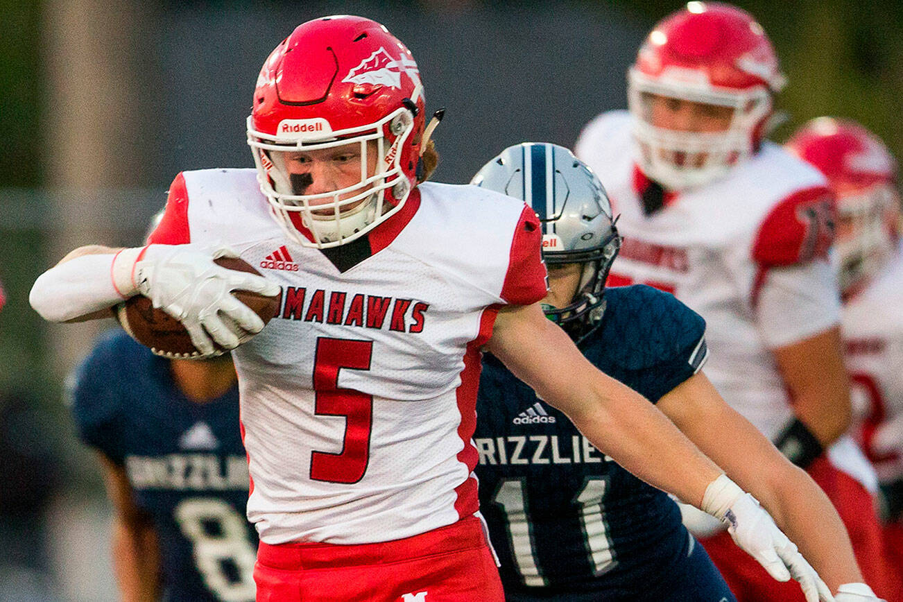 Marysville-Pilchuck's Dylan Carson is tackled by Glacier Peak’s Reggie Valmonte during the game on Friday, Sept. 24, 2021 in Snohomish, Wa. (Olivia Vanni / The Herald)