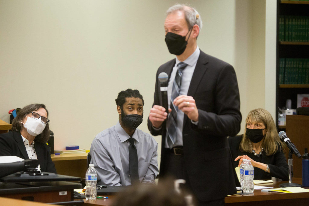 Defendant Kevin Lewis and his attorneys listen to closing arguments by deputy prosecutor Jarett Goodkin in Lewis’ murder trial at the Snohomish County Courthouse on Thursday in Everett. (Andy Bronson / The Herald)
