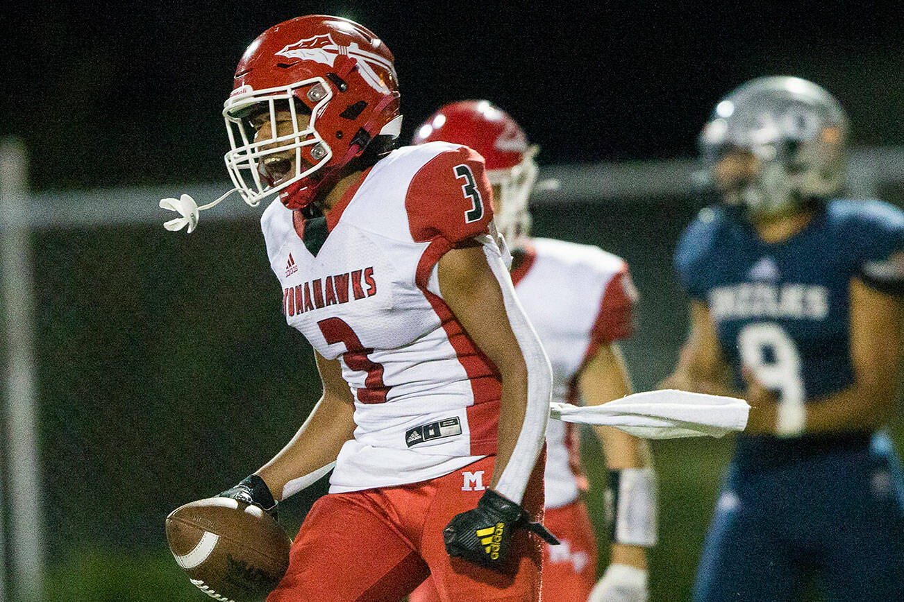 Glacier Peak’s Ashton Olson yells while celebrating a touchdown during the game against Glacier Peak on Friday, Sept. 24, 2021 in Snohomish, Wa. (Olivia Vanni / The Herald)