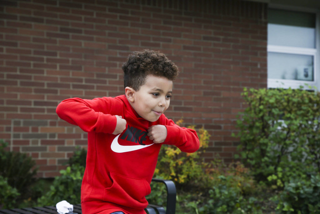 Robert, 5, imitates a turkey as he answers questions about Thanksgiving outside Mount Pilchuck Elementary on Monday in Lake Stevens. (Andy Bronson / The Herald)
