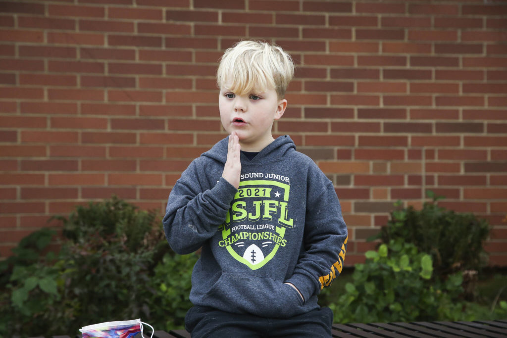 Nixon, 6, describes a turkey’s wattle as he answers questions about Thanksgiving outside Mount Pilchuck Elementary on Monday in Lake Stevens. (Andy Bronson / The Herald)
