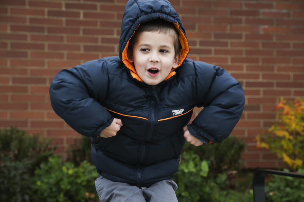 Mason, 6, imitates a turkey as he answers questions about Thanksgiving outside Mount Pilchuck Elementary on Monday in Lake Stevens. (Andy Bronson / The Herald)
