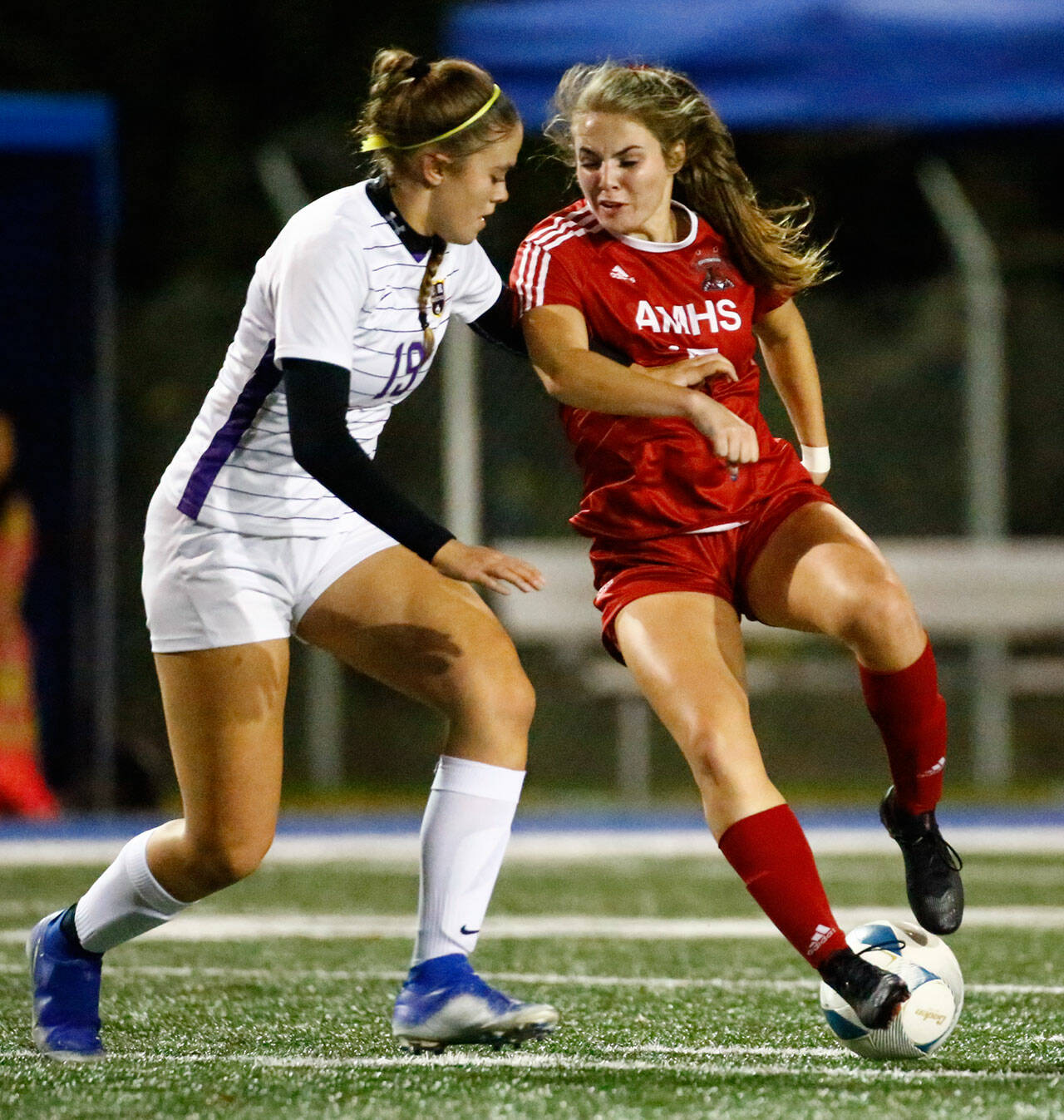 Archbishop Murphy’s Jordyn Latta reverses her dribble against Columbia River’s Ava Lapinskas in the first half Friday night at Shoreline Stadium on November 19, 2021. (Kevin Clark / The Herald)