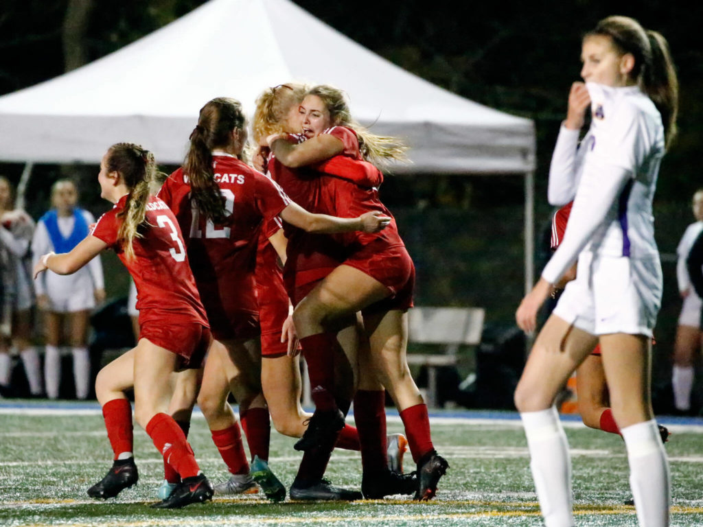 Archbishop Murphy celebrates a goal by Archbishop Murphy’s Jordyn Latta in the second half Friday night at Shoreline Stadium on November 19, 2021. The Wildcats advance to the state championships with the 2-1 win over the Rapids. (Kevin Clark / The Herald)
