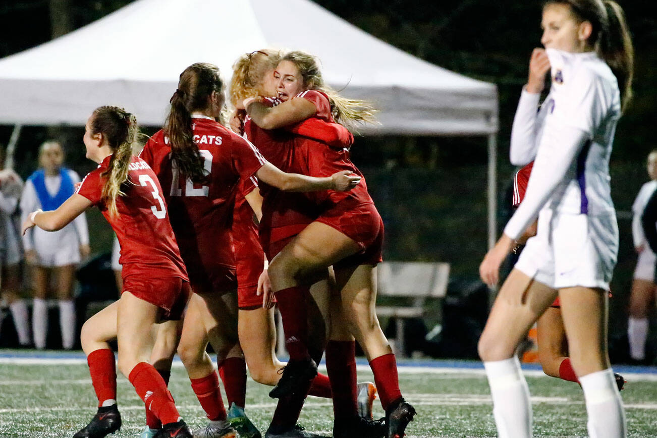 Archbishop Murphy celebrates a goal by Archbishop Murphy's Jordyn Latta  in the second half Friday night at Shoreline Stadium on November 19, 2021. The Wildcats advance to the state championships with the 2-1 win over the Rapids. (Kevin Clark / The Herald)