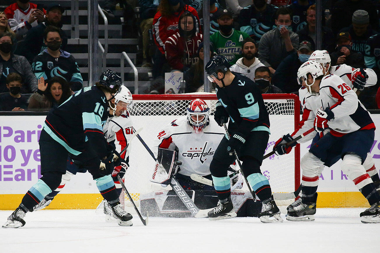 Seattle Kraken center Jared McCann (16) shoots and scores against Washington Capitals goaltender Vitek Vanecek during the first period of an NHL hockey game, Sunday, Nov. 21, 2021, in Seattle. (AP Photo/Lindsey Wasson)