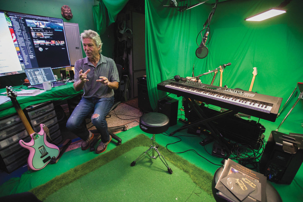 Roger Fisher talks about his One Vision Project in his home studio. (Olivia Vanni / The Herald)

