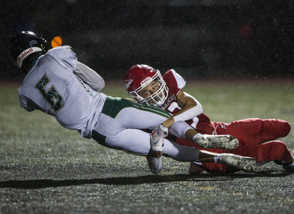 Marysville Pilchuck’s Jaxon Petermeyer tackles Marysville Getchell’s Carter Schmidt during the Berry Bowl on Sept. 17 Marysville. (Olivia Vanni / The Herald)
