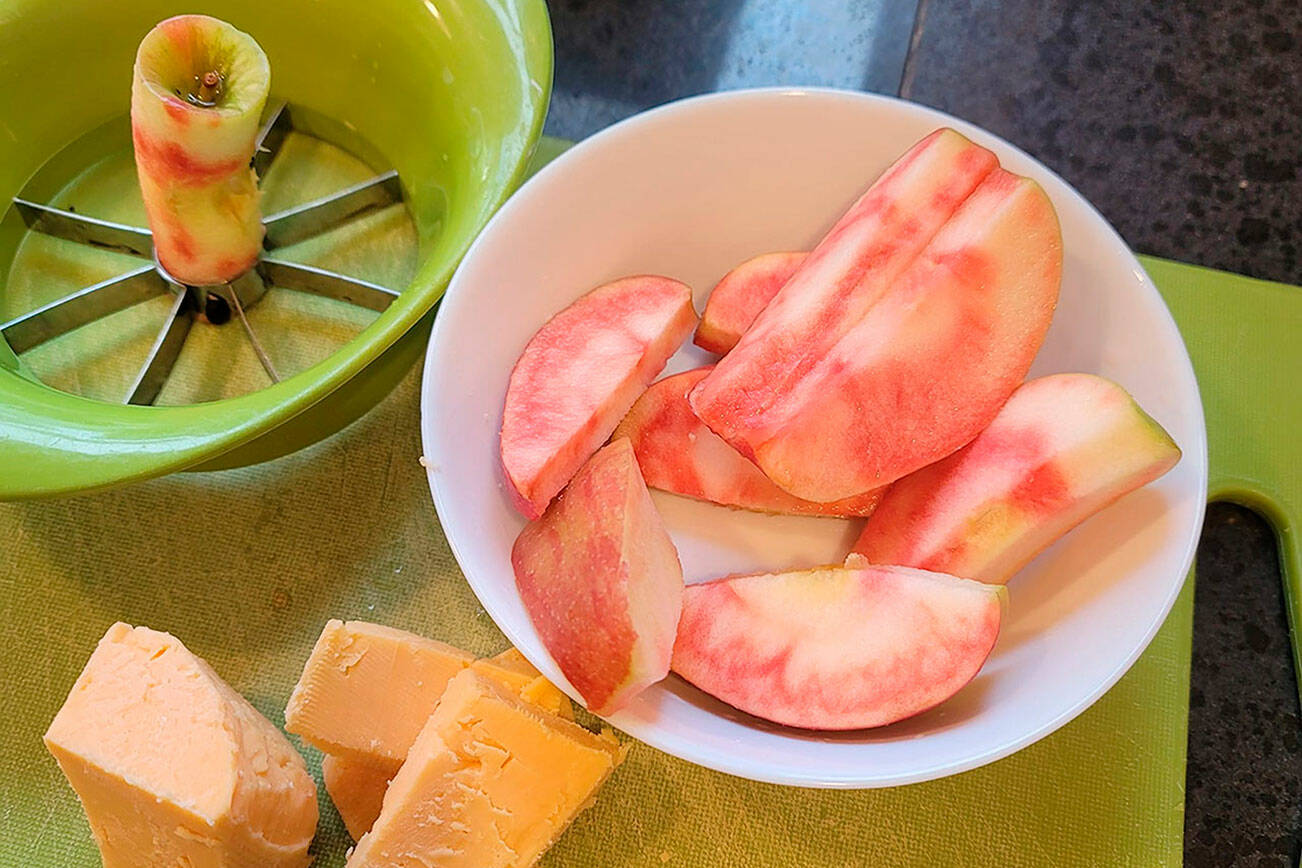 Bill Howell, a plant pathologist from Prosser, created the Lucy Rose apple variety as a cross between the Honeycrisp and an Airlie Red variety. They are notable for their red centers.(Jennifer Bardsley)