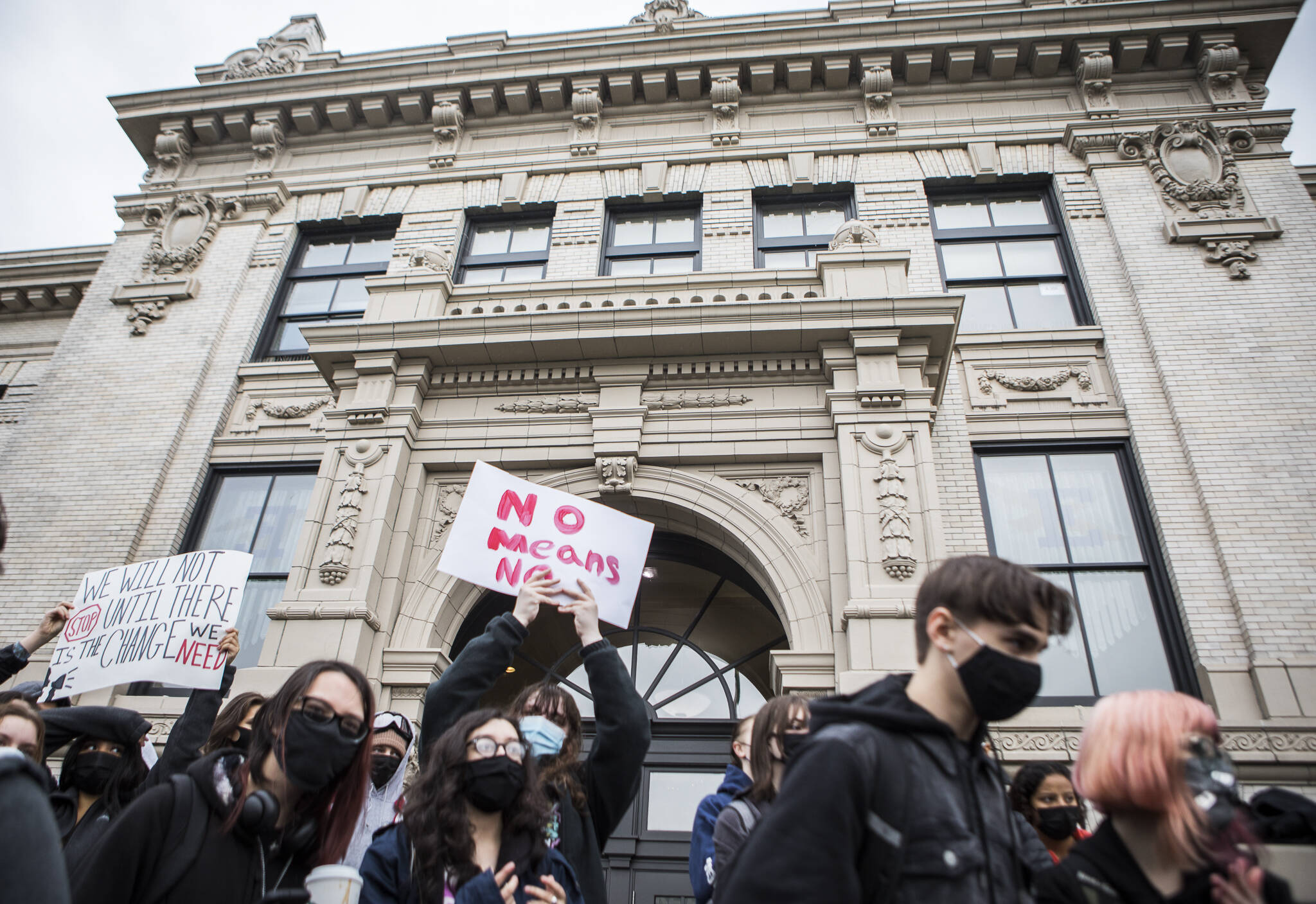 Students gather in front of Everett High School on Dec. 16 for a walkout to call attention to the prevalence of sexual assault and to ask the school district to implement changes to stop it. (Olivia Vanni / The Herald)