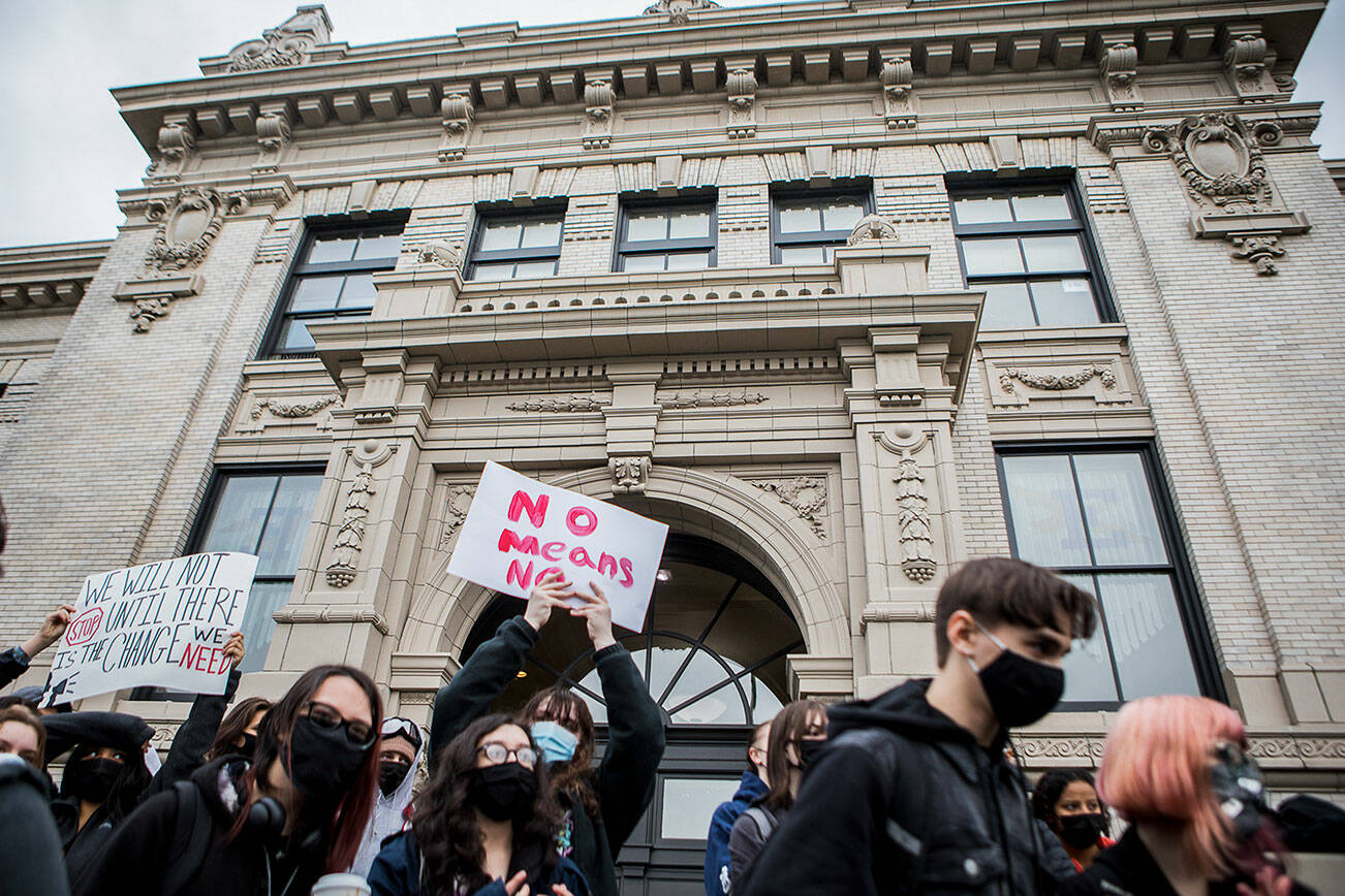 Students gather in front of Everett High School on Thursday, Dec. 16, 2021 for a walkout, calling attention to the prevalence of sexual assault and to ask the school district to implement change to stop it. (Olivia Vanni / The Herald)