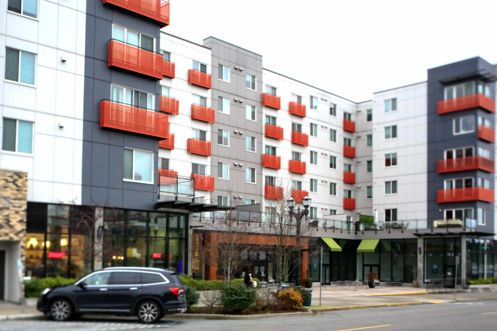 Projects of disgraced Everett developer Lobsang Dargey include the Grand Avenue Apartments in Everett, a 220-unit apartment building with ground-floor shops. (Kevin Clark / The Herald)
