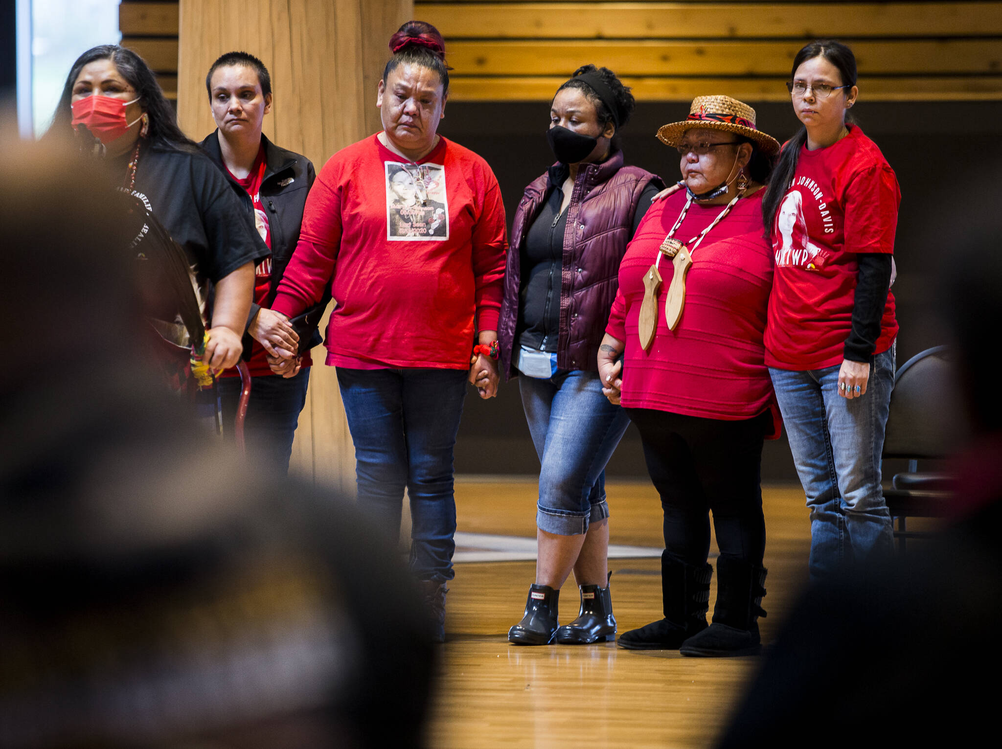 The family of Mary Ellen Johnson-Davis listens to advocate Roxanne White during a gathering Thursday to support the continued search for the missing Tulalip Tribes member. (Olivia Vanni / The Herald)