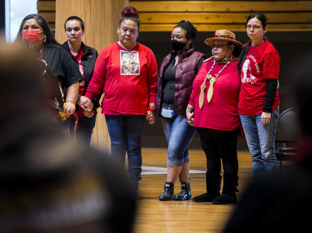 The family of Mary Ellen Johnson-Davis listens to advocate Roxanne White during a gathering Thursday to support the continued search for the missing Tulalip Tribes member. (Olivia Vanni / The Herald)
