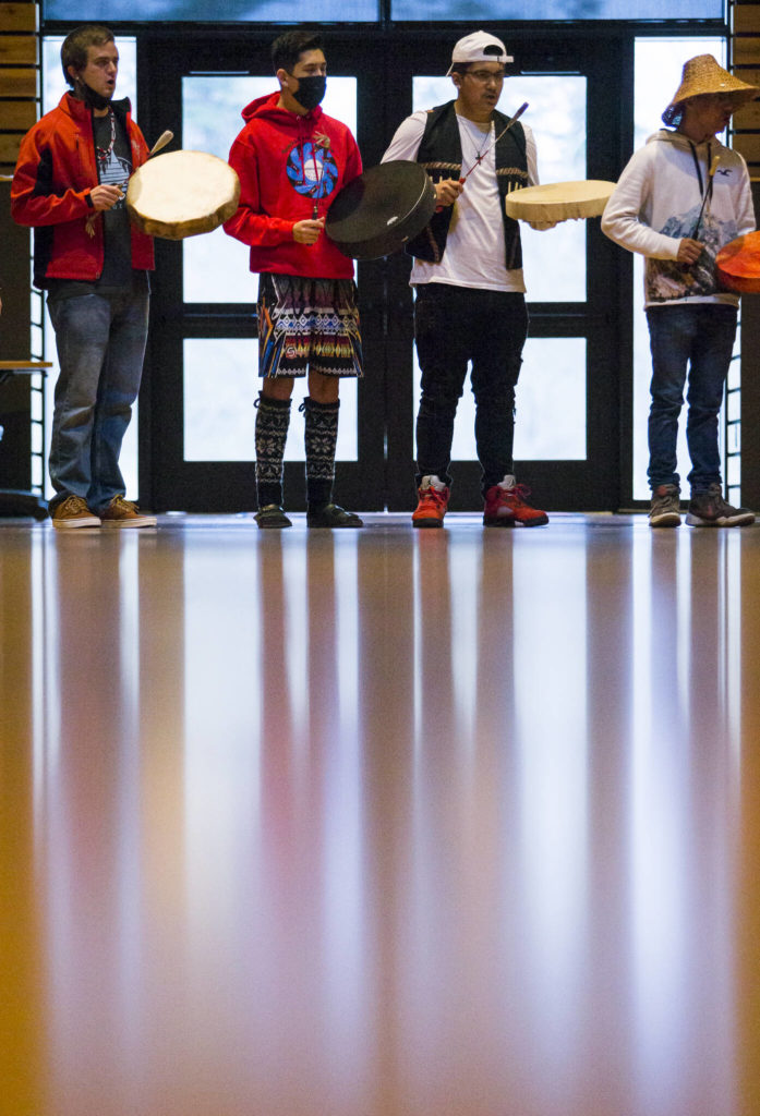 People drum and sing in support of the continued search for Mary Ellen Johnson-Davis during a gathering Thursday in Tulalip. (Olivia Vanni / The Herald)
