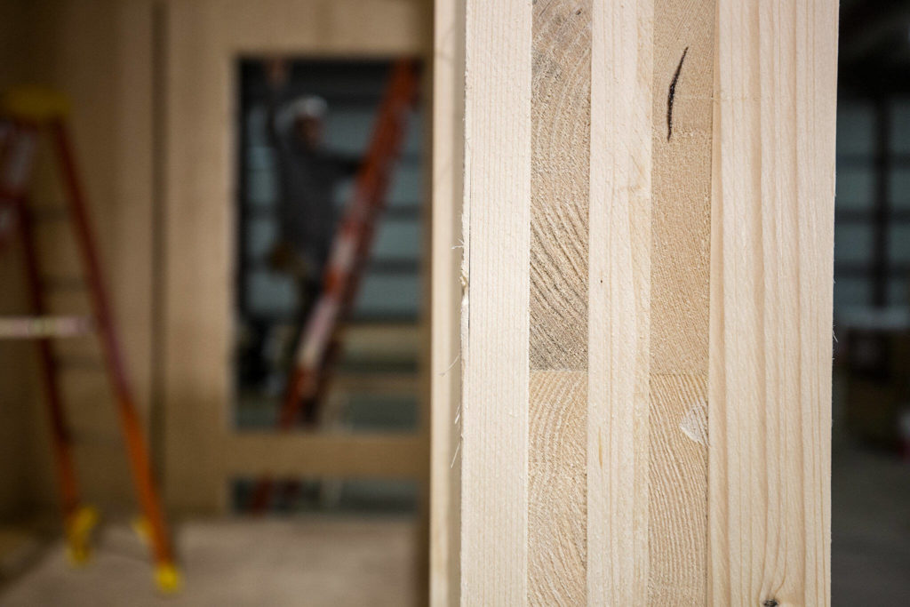 A view of a cross-laminated timber modular home under construction inside a warehouse on Marine View Drive in Everett. (Andy Bronson / The Herald)
