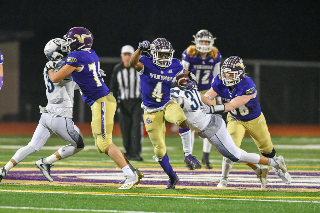 Lake Stevens’ Trayce Hanks eludes defenders during a 4A state quarterfinal game against Gonzaga Prep on Nov. 20, 2021, at Lake Stevens High School. (John Gardner / Pro Action Image)
