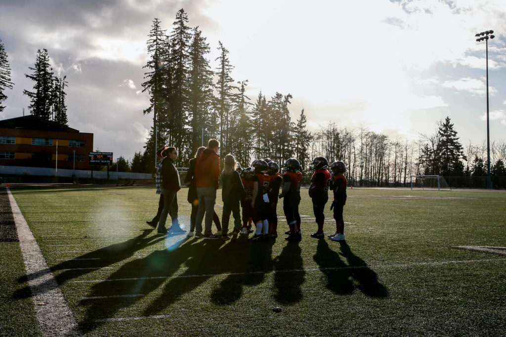 The Marysville Tomahawks take a timeout during the Buddy Bowl Saturday at Marysville Getchell High School in Marysville. (Kevin Clark / The Herald)
