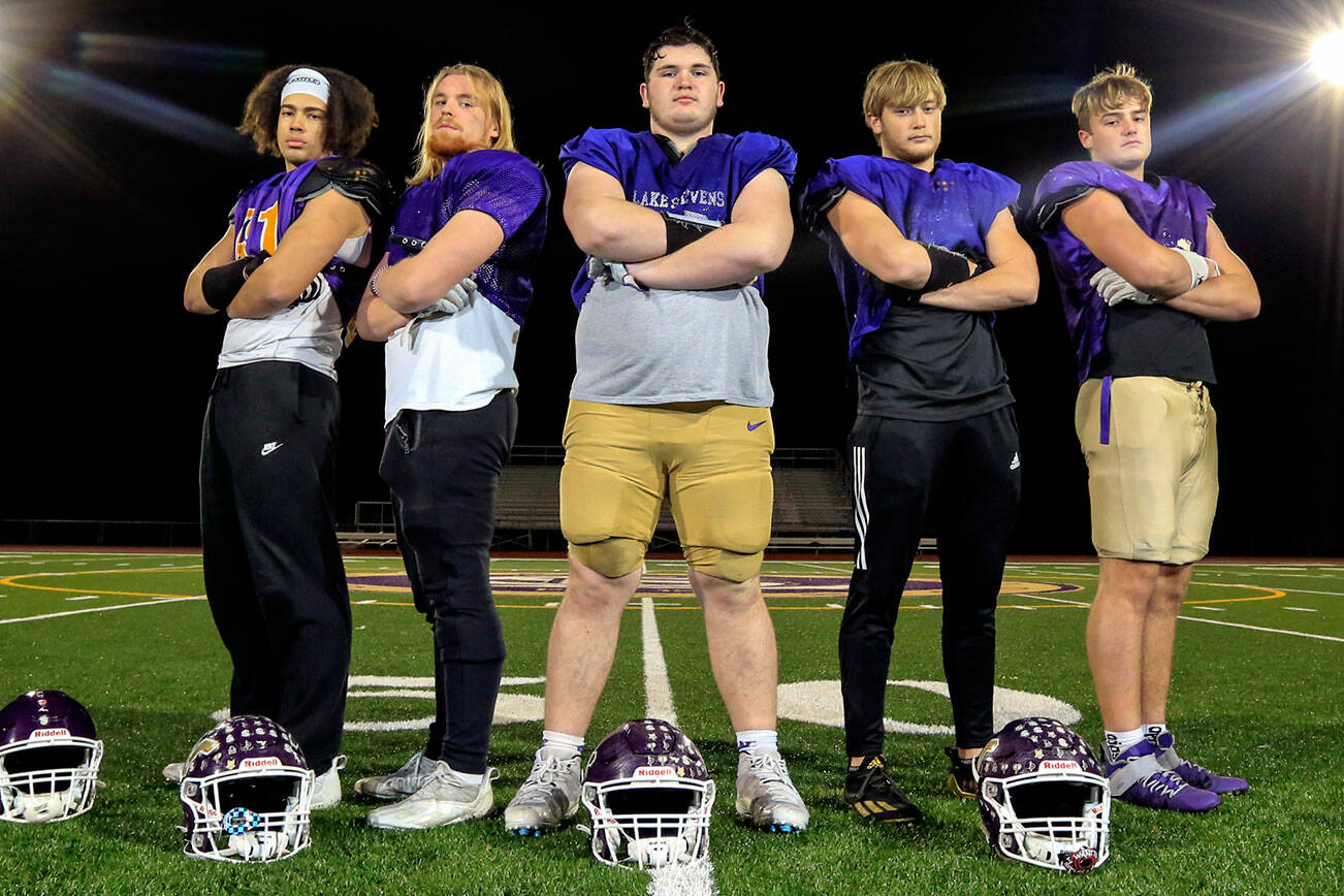 Lake Stevens' Micah Avery, left-right, Ashten Hendrickson, Grant Lynch, Dylan Slezak and Bryce Slezak are the starting offensive linemen for Lake Stevens state championship run. (Kevin Clark / The Herald)