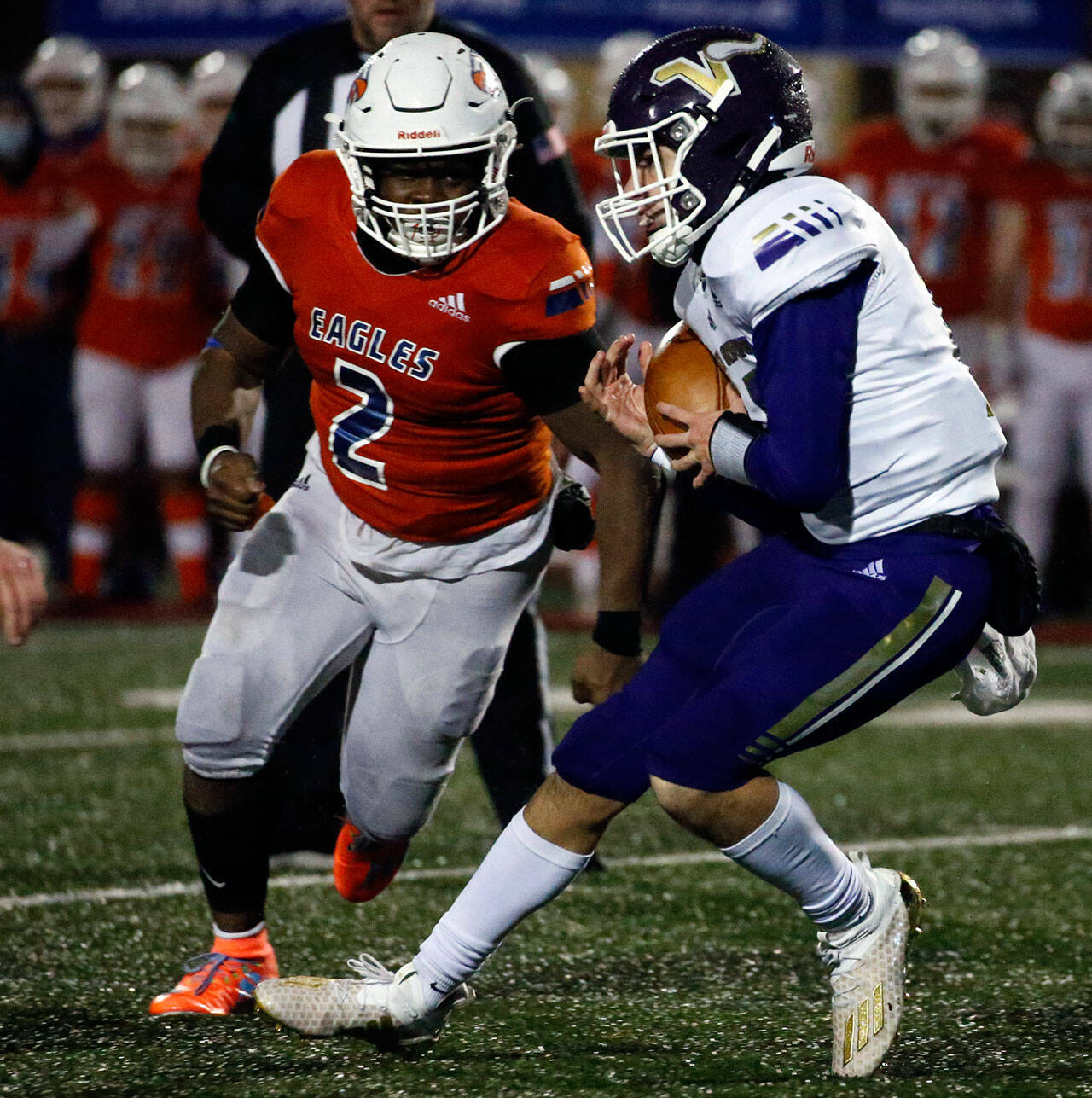 Lake Stevens’ Kolton Matson halts his scramble with Graham-Kapowsin’s Jalen Davenport closing in during the Class 4A state title game Saturday evening at Mt.Tahoma High School in Tacoma. Matson, a freshman, helped lead Lake Stevens to a pair of playoff wins while filling in for injured senior starter Grayson Murren. (Kevin Clark / The Herald)