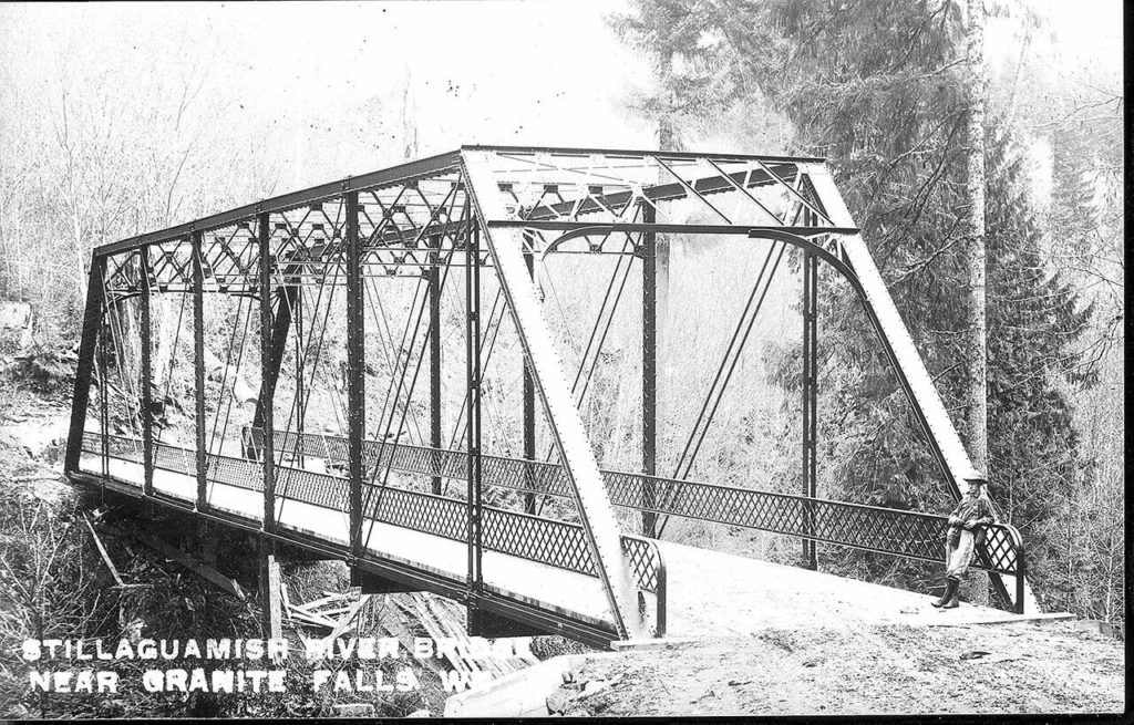 This steel bridge over the South Fork Stillaguamish River was built in 1911 and later replaced by the structure that stands today just east of Granite Falls. (Granite Falls Historical Society)
