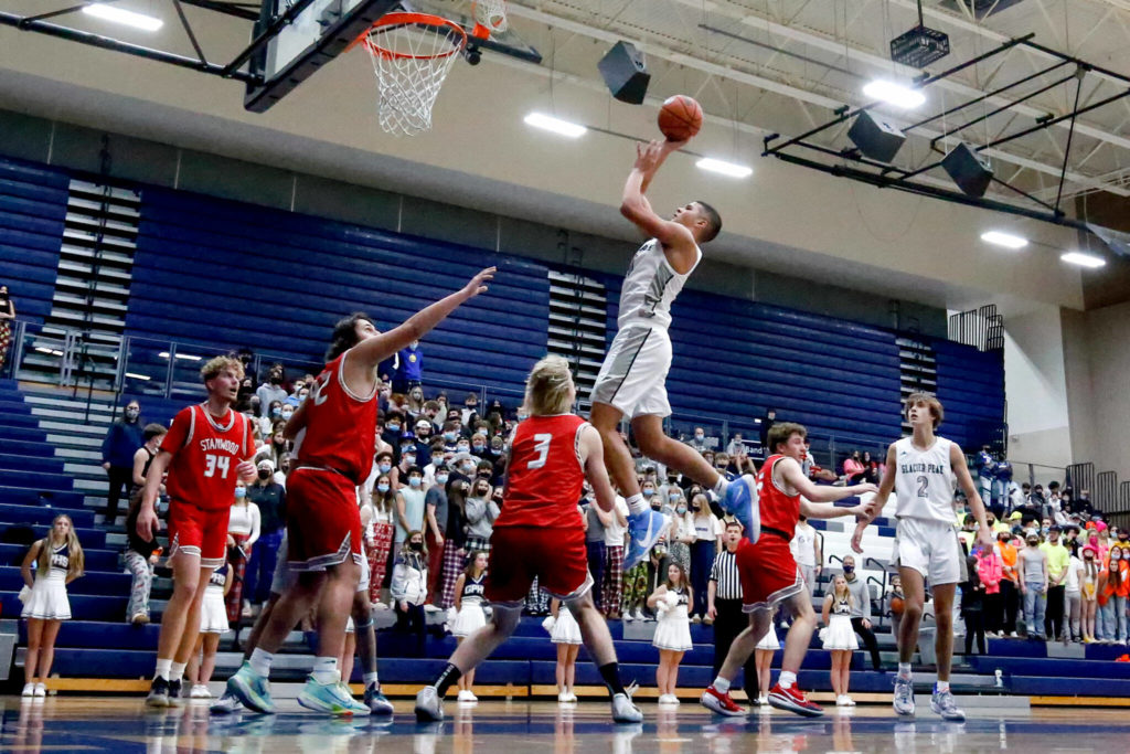 Glacier Peak’s Torey Watkins pulls up for a basket during a game against Stanwood on Friday evening at Glacier Peak High School in Snohomish. The Grizzlies won 66-54. (Kevin Clark / The Herald)
