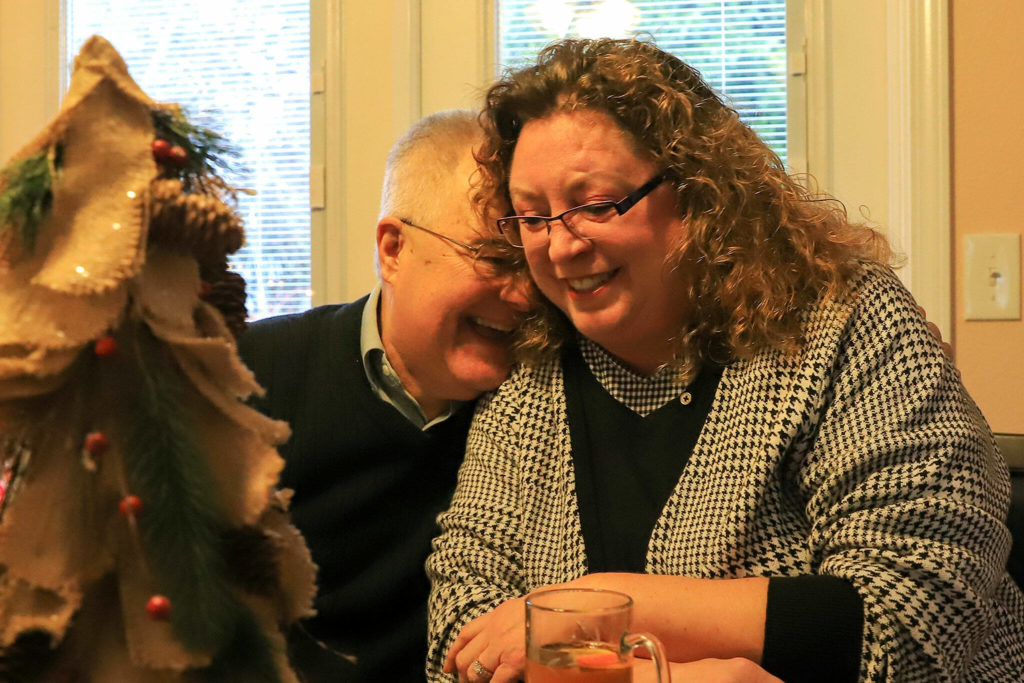 Laird Will and his newfound sister, Glenna Atkins, share a laugh at her Marysville home. Through a home DNA test, he found his biological mom and two siblings. (Kevin Clark / The Herald)
