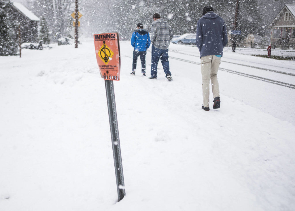 A small sign marks the location of an untapped fiber-optic cable that runs through Skykomish. (Olivia Vanni / The Herald)
