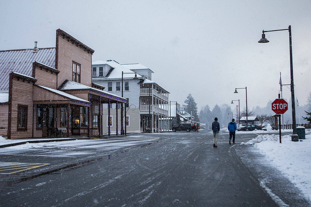 Students from Tony Grider's 11th grade class walk through the town on Tuesday, Dec. 14, 2021 in Skykomish, Wa. (Olivia Vanni / The Herald)