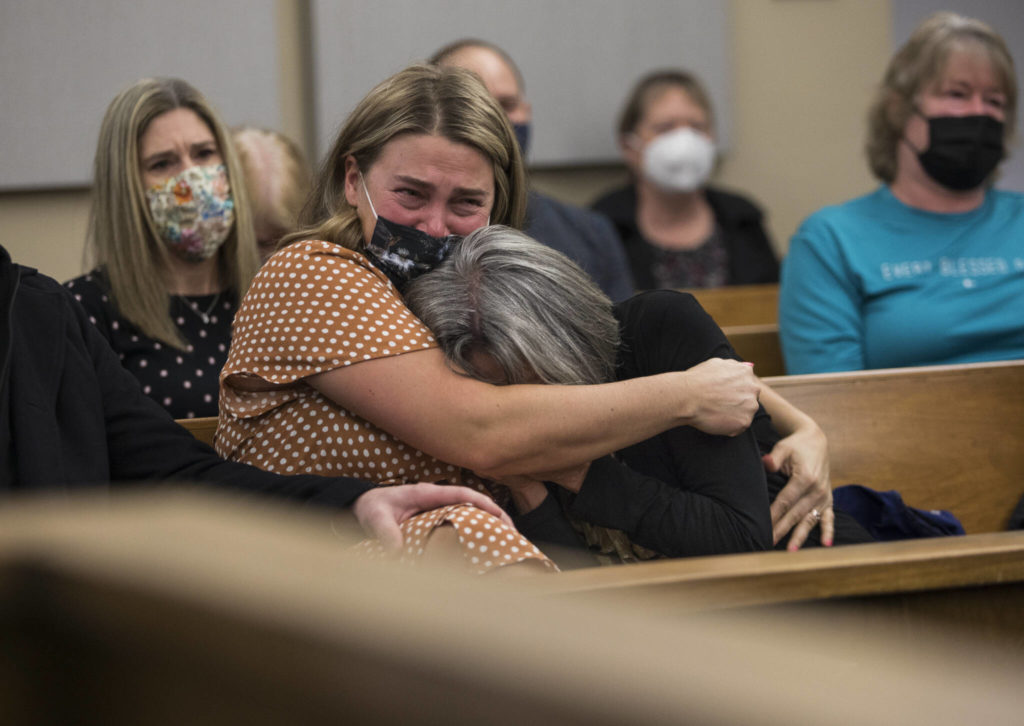Breanne Neuman (left) cries and hugs her mother, Denise Benzel, as Snohomish County Superior Court Judge Anna Alexander sentences Frank Walton to 18⅓ years in prison for the murder of Howard Benzel. (Olivia Vanni / The Herald)
