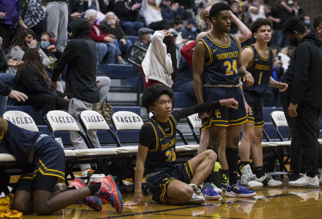The Shorecrest bench reacts to a missed shot in the final seconds of regular time to send the game against Arlington to overtime on Tuesday, Dec. 14, 2021 in Arlington, Wa. (Olivia Vanni / The Herald)
