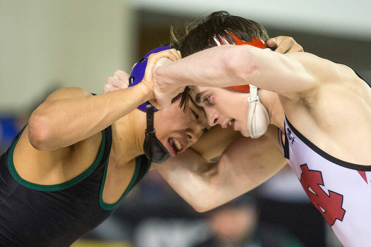 Trying to get the upper hand, Edmonds-Woodway's Ethan Nguyen, left, battles North Central's Steven Zaragoza. Hguyen lost 11-2 in their championship match at Mat Classic XXXII in the Tacoma Dome on Saturday, Feb. 22, 2020 in Tacoma, Wash. (Andy Bronson / The Herald)
