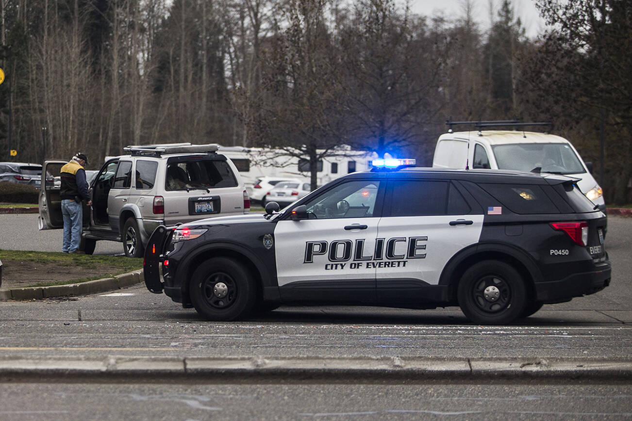 Everett Police respond to an accident along Highway 99 just north of Airport Road on Tuesday, Dec. 21, 2021 in Everett, Wa. (Olivia Vanni / The Herald)