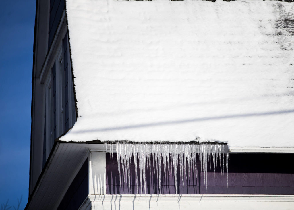 Icicles hang from the gutter of a home along Grand Avenue on Monday in Everett. (Olivia Vanni / The Herald)
