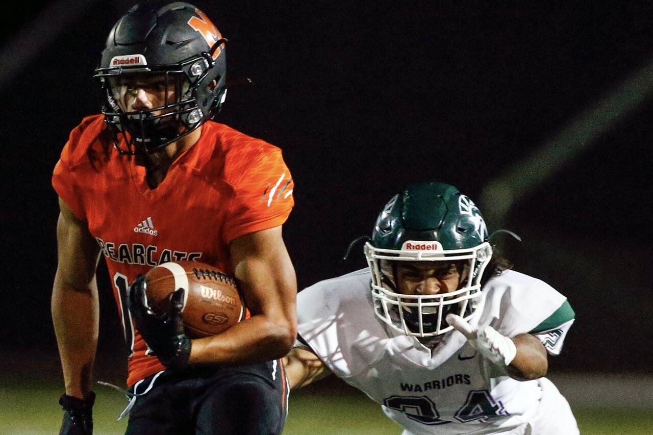 Monroe senior Cole Pruett (left) excelled on offense, defense and special teams for the Bearcats. (Kevin Clark / The Herald)