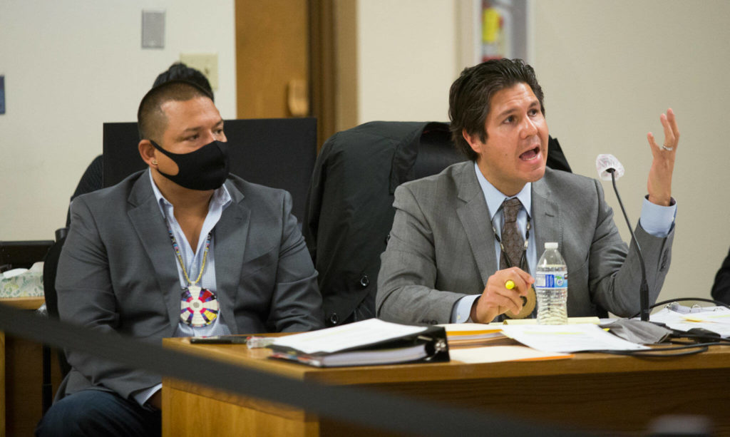 Defense attorney Gabe Galanda (right) questions a witness during a hearing for Tulalip tribal members Hazen Shopbell (left) and Anthony Paul in Skagit County Superior Court on Oct. 25 in Mount Vernon. (Andy Bronson / The Herald)
